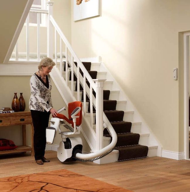 enjoying home mobility - A heartwarming image of a family embracing the convenience and joy of a stairlift by Aussie Glide, emphasizing the positive impact on daily life and shared moments