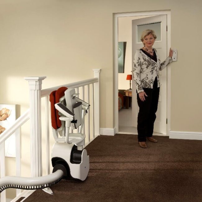 Women near Control of Flow2 Indoor Curved Rail Stairlift